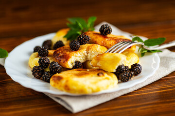 Warm homemade pancakes with pine cone syrup and herbs