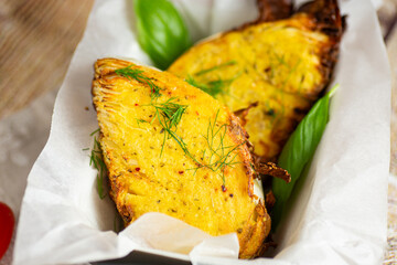 Healthy vegetarian baked cabbage slices with golden crust