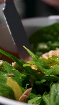 Hand woman chef Mixing Green Salad , Millet,Crab Stick In glass bowl. Breakfast fresh salad and clean vegetable can eat raw. Nutritious and enzymes in Salad mix leaves green vegetable can detox. 