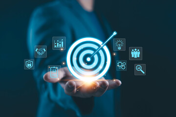 Business target strategy concept with professional holding digital target and arrow. Goal achievement, data analytics, marketing planning, performance growth, innovation corporate success background.