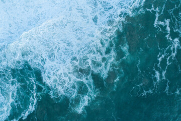Top Down Aerial View of Deep Blue Ocean with White Foam The Concept of Power