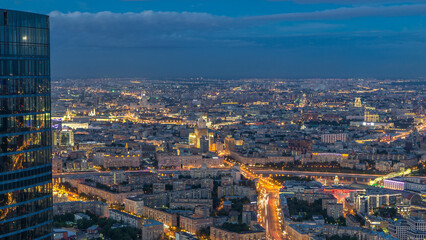 Aerial top view of Moscow city day to night timelapse after sunset. From the observation deck