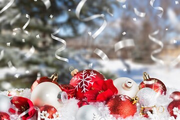 Christmas balls in setting of Winter holidays background.