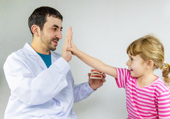 A child at the dentist gets his teeth treated. Selective focus.