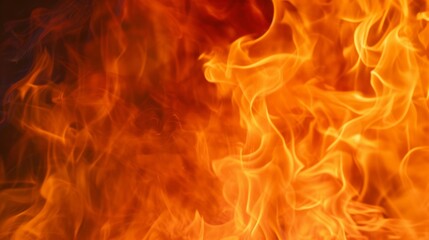 Obraz premium Burning fire flames background texture. Abstract orange and red inferno. Hot heat energy concept