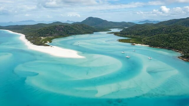 Whitehaven beach's swirling silica sand and turquoise water creating beautiful patterns, with boats sailing on the vibrant tropical sea surrounded by lush green islands
