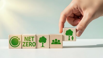 Hand placing a block with a tree icon to complete a net zero puzzle