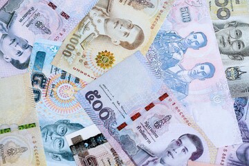 Thai baht currency money. The current banknotes lies on table in big amount close up