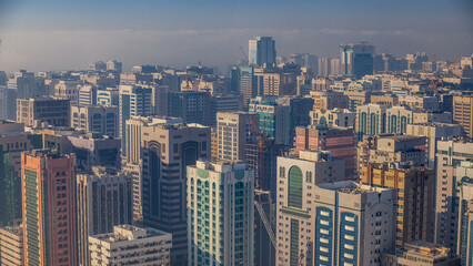 Fototapeta premium Skylines under the thick fog at the street timelapse of Abu Dhabi at morning