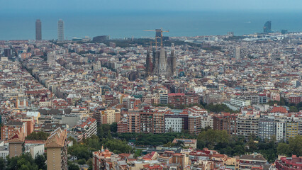 Fototapeta premium Panorama of Barcelona night to day timelapse, Spain, viewed from the Bunkers of Carmel