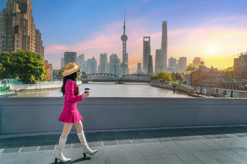 Tourists sightseeing on The Bund and Lujiazui of Shanghai, China.