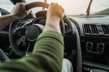 Driving a Car on a Rainy Road During Daylight