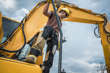 Worker Operates Heavy Machinery Near Power Lines