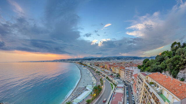 Fototapeta Sunset over Nice city and Mediterranean Sea aerial timelapse