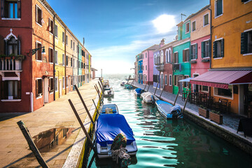 Venice. Island of Burano colorful houses and channel view
