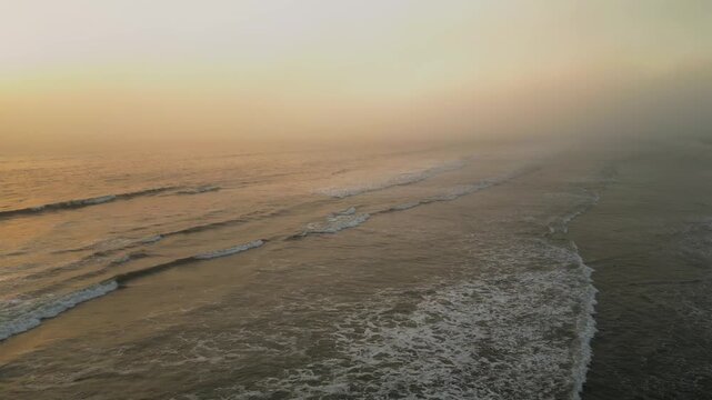 Aerial Summer Sunset at Puerto Eten, Chiclayo, Lambayeque, Golden Sandy Beach and Calm Pacific Ocean, Ideal Tropical Coastal Destination