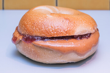 A sophisticated take on the classic bagel with salmon, where whipped cream cheese with lemon and dill melts with slices of cold-smoked salmon on a crispy dark rye bagel