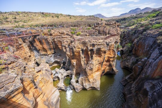 Canyon with steep orange-coloured cliffs with the Blyde River, Bourke's Luck Potholes, Panorama Route, Mpumalanga, South Africa