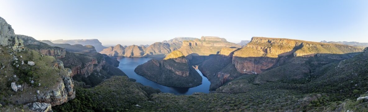 Panorama, sunset at Blyde River Canyon with Three Rondawels peak, view of canyon with Blyde River and table mountains in the evening light, canyon landscape, Panorama Route, Mpumalanga, South Africa