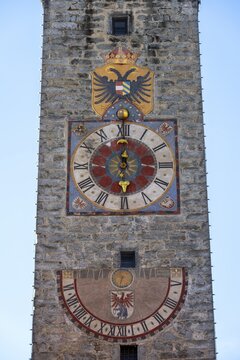 Colourful tower clock with coat of arms and sundial, Zw&ouml;lferturm, historic old town, Sterzing, South Tyrol, Italy