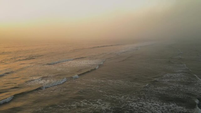 Aerial Summer Sunset at Puerto Eten, Chiclayo, Lambayeque, Golden Sandy Beach and Calm Pacific Ocean, Ideal Tropical Coastal Destination