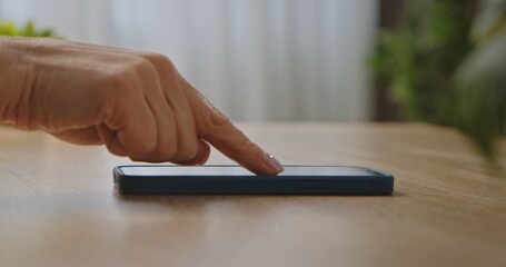 Close up of Finger Touching a Smartphone Screen