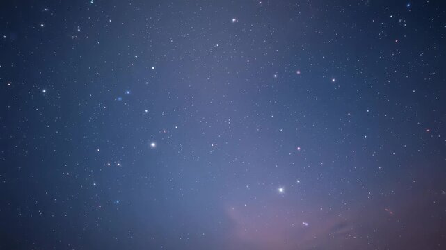 Shifting night sky star field drifting slowly across horizon over time, with pinkish cloud band