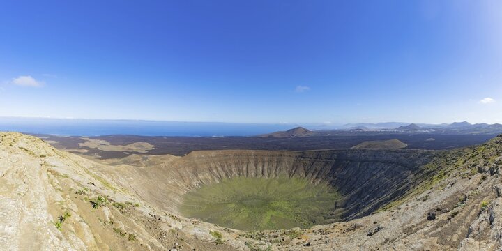 Panorama from the crater rim into the crater of Caldera Blanca, Parque Natural de Los Volcanes, Lanzarote, Canary Islands, Spain