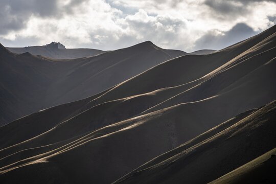Mountain silhouette and hills in the sunlight, Dramatic mountain landscape, Tian Shan, Sky Mountains, Sary Jaz Valley, Kyrgyzstan