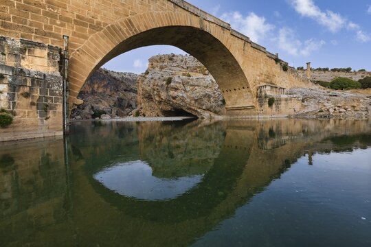 2nd century AD Severan roman bridge on the Cendere River with the columns of the Roman Emperor Septimus Severus and the Empress Julia Domna, Turkey