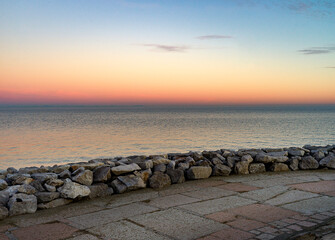 Landscape with the winter sea and the colors of the sunset