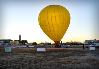Landscape with the preparation and inflation of a hot air balloon