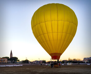 Landscape with the preparation and inflation of a hot air balloon