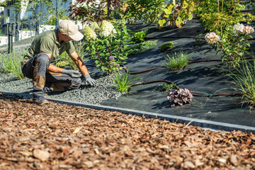 Gardener Designing Sloped Landscape in Sunlight