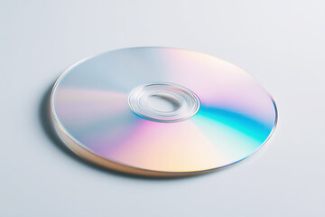 CD placed on a plain surface with light reflecting off its surface in the afternoon