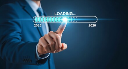 Fototapeta premium Businessman touching virtual loading bar from 2025 to 2026, symbolizing future progress.