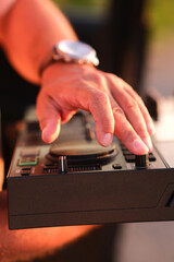 Male DJ Hand Mixing Music on DJ Console