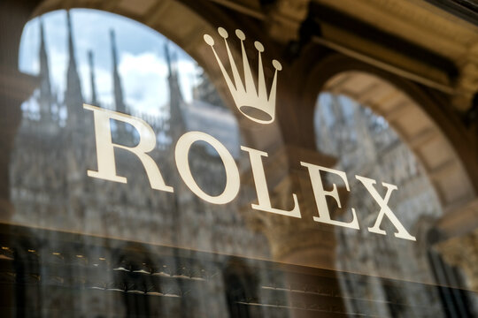 Milan, Italy - September 14, 2025: Rolex store front showcasing luxury watches with elegant architecture in the background and reflections on glass