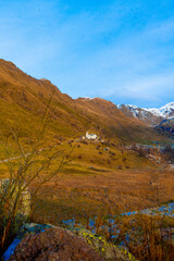 Landscape with a church in the mountains in winter, Lecco, Italy