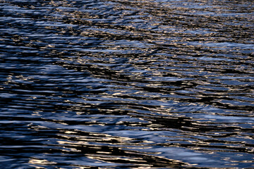 Texture shown on the surface of the Paca lagoon in motion during sunset.