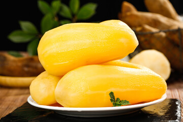 Fresh Yellow Papayas on Plate with Ginger and Mint
