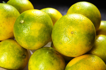 Fresh Green and Yellow Citrus Fruits Close-Up