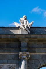 Cherub sculpture on top of Puerta de Alcala arch in Madrid