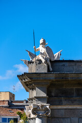 Cherub sculpture on top of Puerta de Alcala arch in Madrid