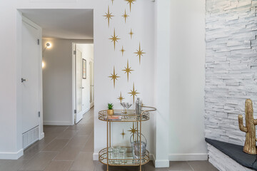 Mid century modern brass bar cart, starburst wall, retro home interior