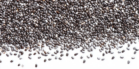 Naklejka premium Close-up of black and white chia seeds scattered on a white surface
