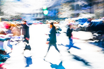 Postmodernism style, artistic motion of people with shopping bags crossing Oxford Circus junction at sunny day. London