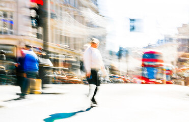 Postmodernism style, artistic motion of people crossing Oxford Circus junction at sunny day. British double decker buses at the background. London