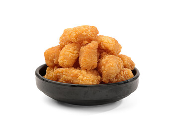 Crispy Golden Chicken Nuggets in Black Bowl on White Background