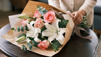 Flower bouquet on wooden table